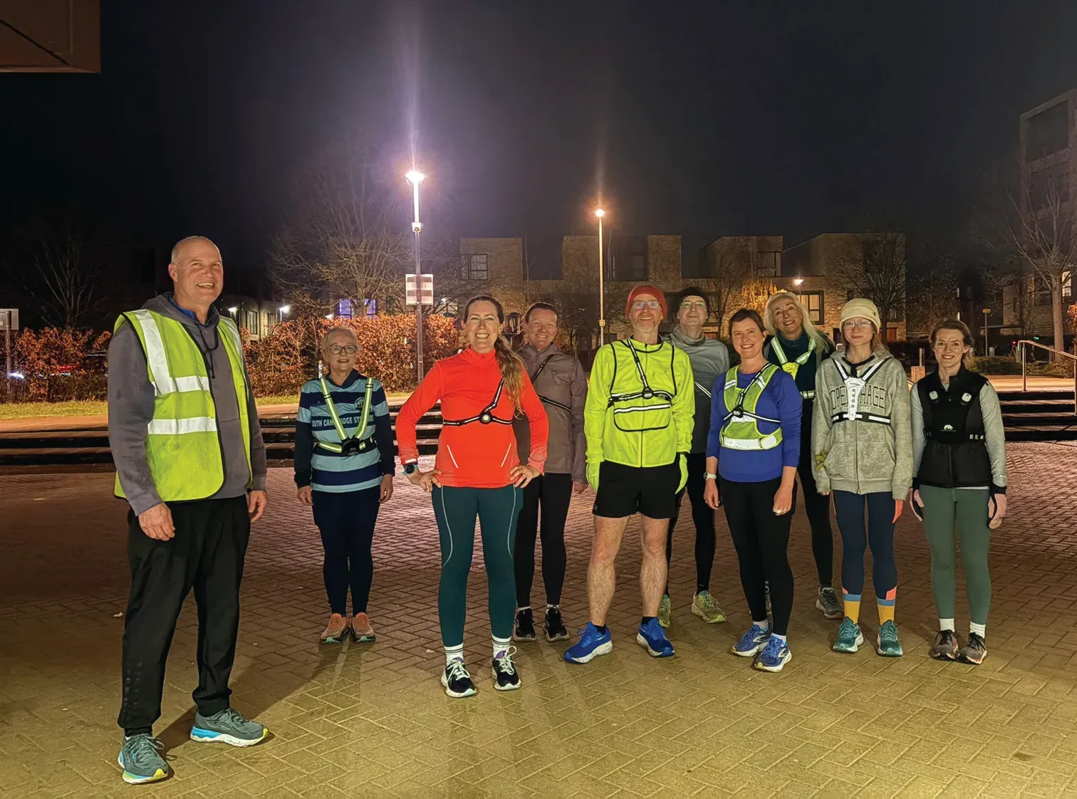 South Cambridge Striders running together at night