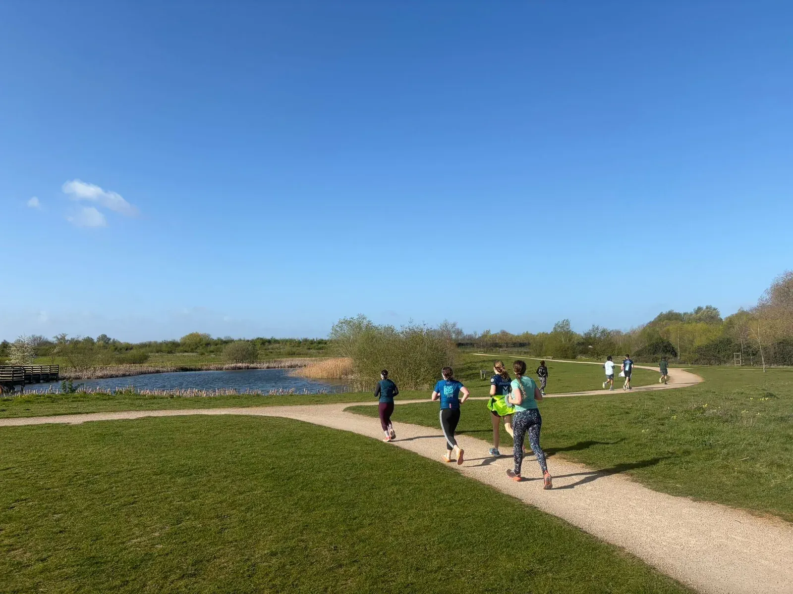 South Cambridge Striders running through Trumpington Meadows